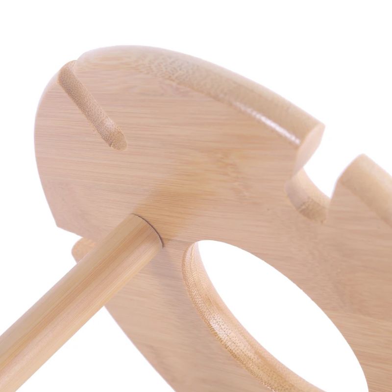 Close up of a bamboo wine glass rack.