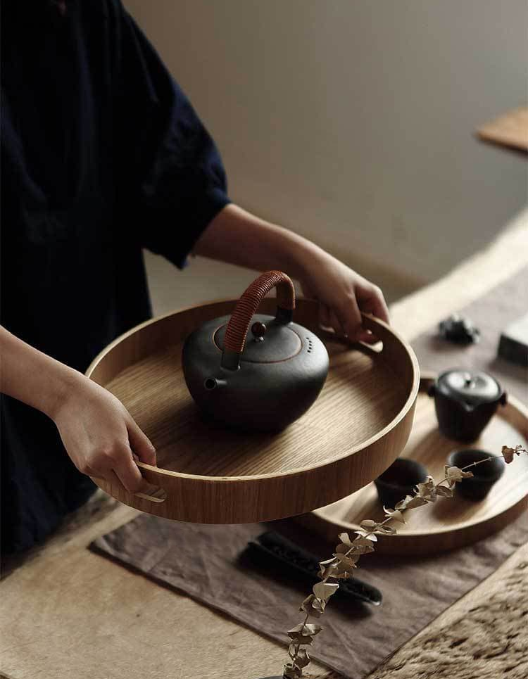 Slim, round serving trays made of wood