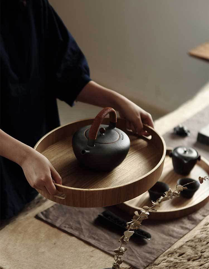 Slim, round serving trays made of wood