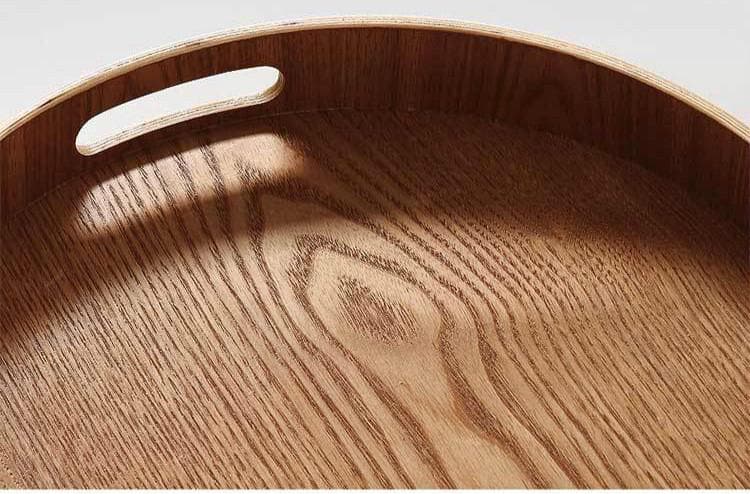 Slim, round serving trays made of wood